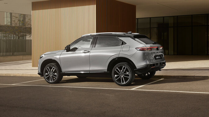 Side facing Honda HR-V in a suburban location with a lookout to the city.